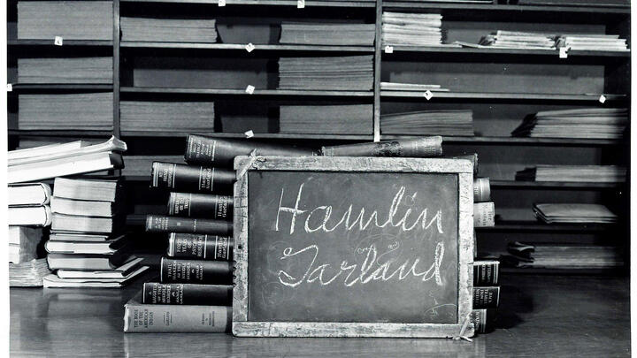Hamlin Garland's name written on a school slate carved with his initials. 