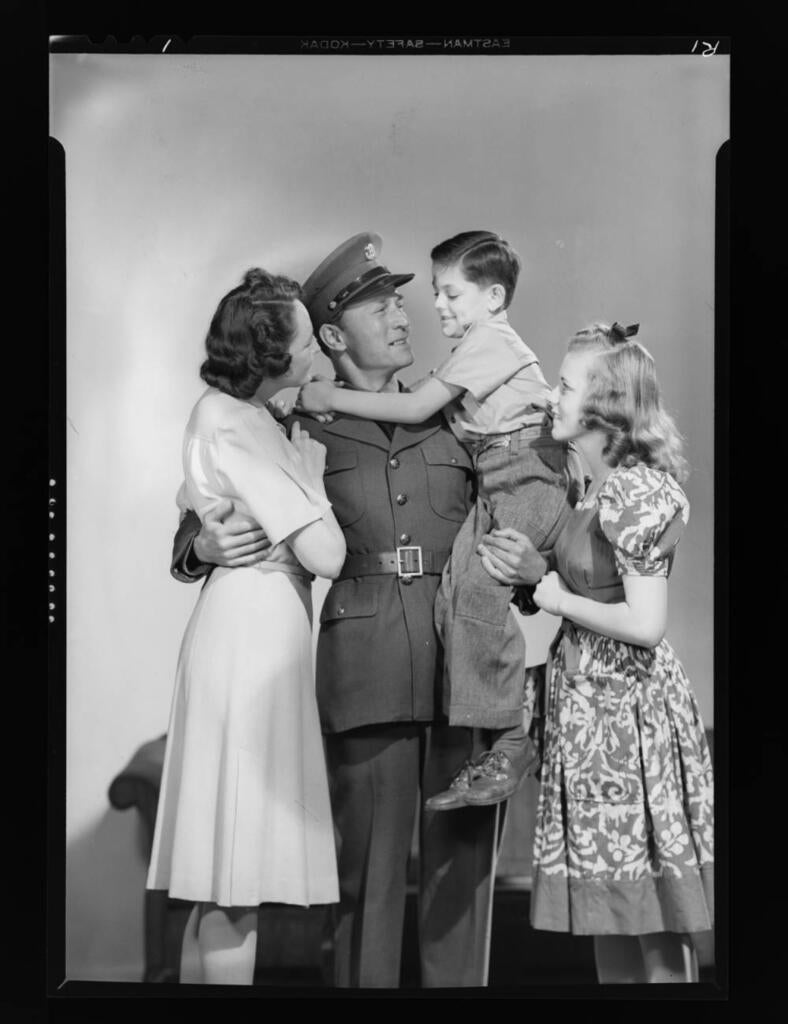 Models posing as family members and soldier, 1942