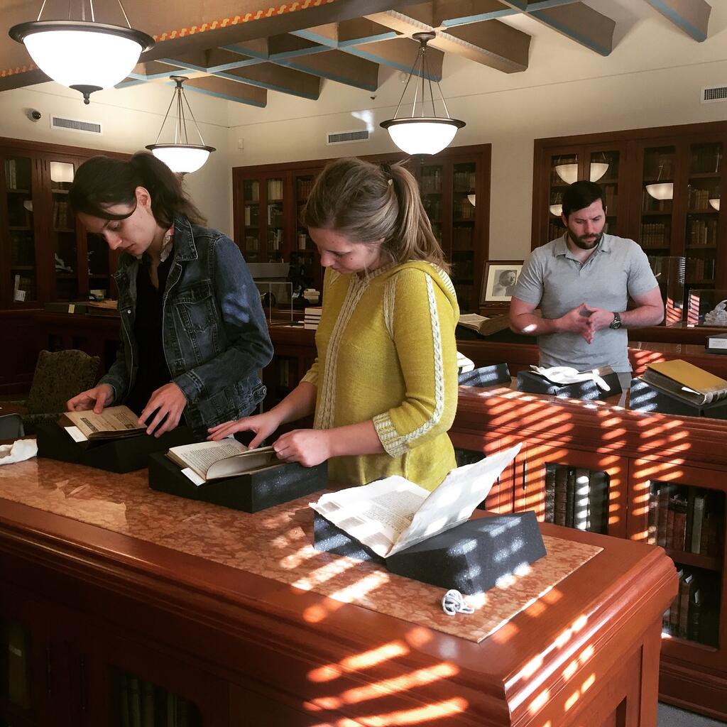 Students critically analyzing rare materials in Special Collections